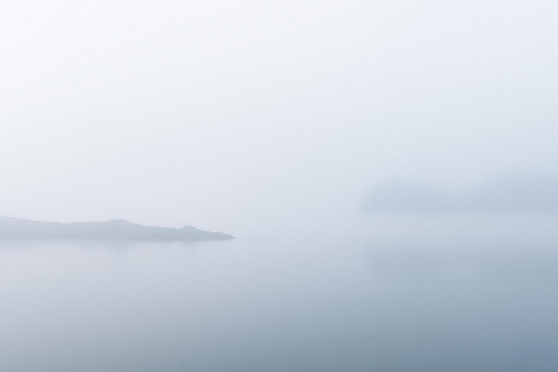 Misty Scandinavian fjord at dawn
